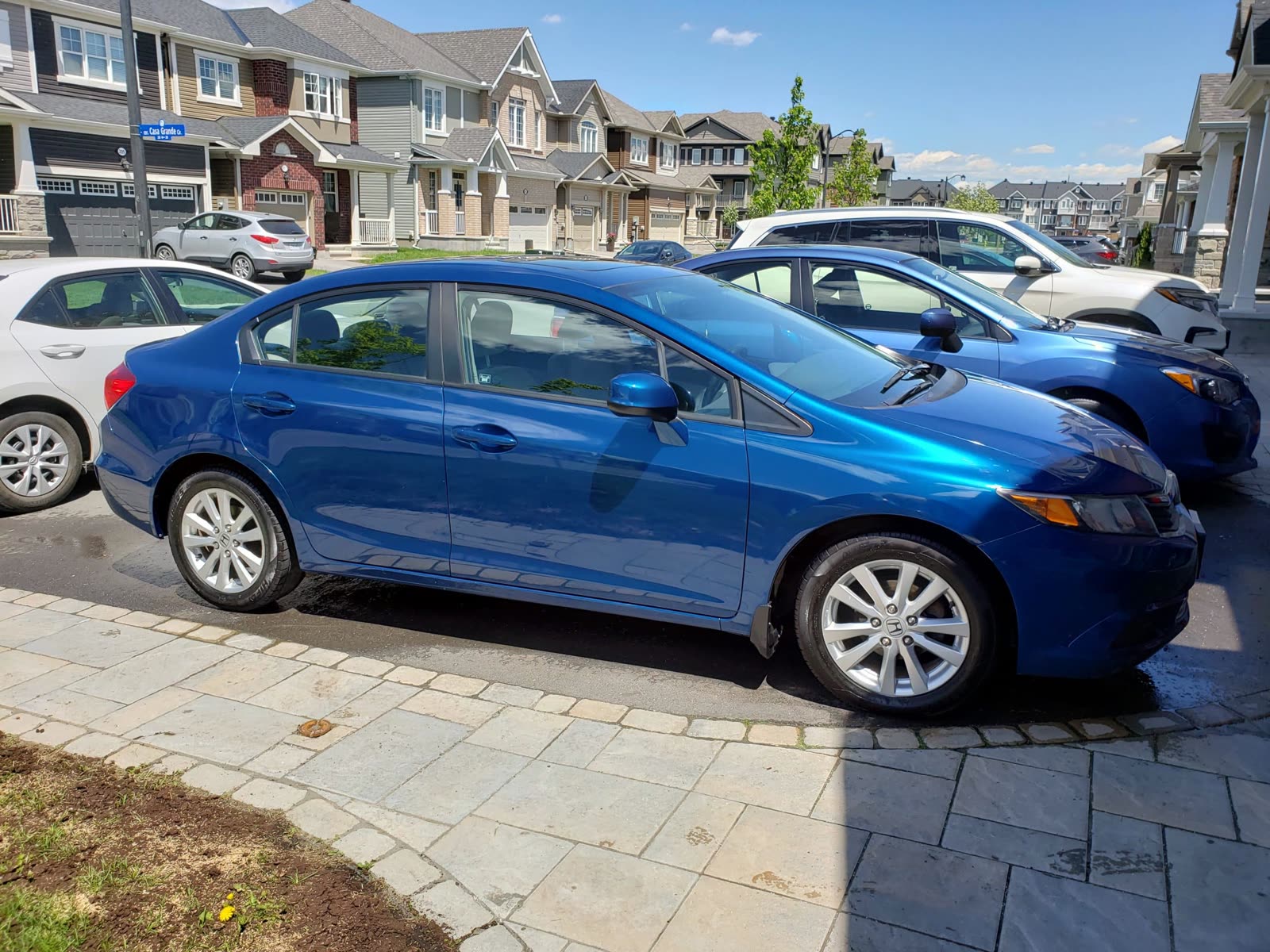 blue car exterior detailed sunny day