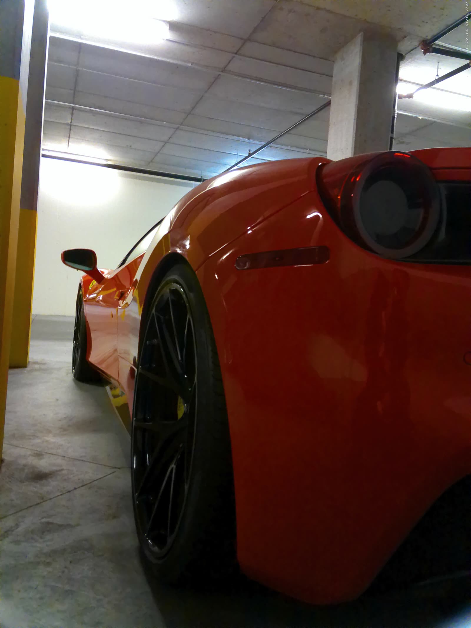 Ceramic coating and exterior detailing on luxury red sports car