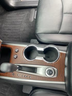 interior car cupholders cleaned and shined with carpet shampoo